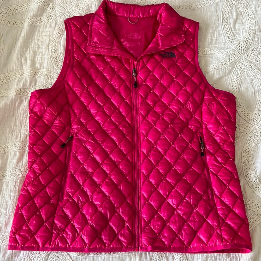 The North Face hot pink puffer vest.